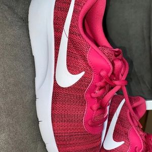 Woman’s/Youth hot pink Nike sneakers